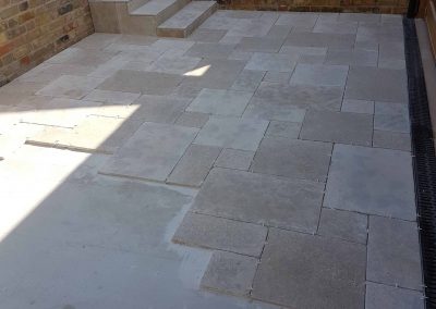 Exterior screeding, tiling to patio with steps (14)