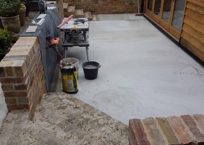 Exterior screeding, tiling to patio with steps (4)