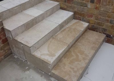 Exterior screeding, tiling to patio with steps (7)